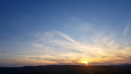 Sunset sky background. Sunset sky background. Sunset sky with clouds. Sunset sky with clouds and sunの写真素材