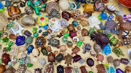 Colorful ceramic souvenirs of different shapes and sizes at the local market.