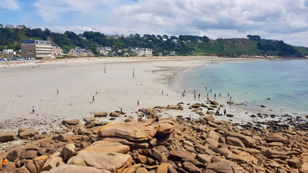 View of Cancale beach with touristsの写真素材