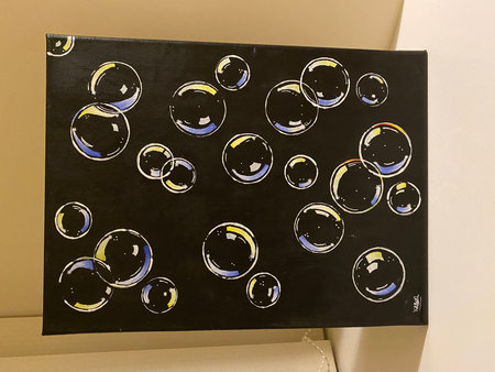 Bubbles on a black board in a museum, closeup of photoの写真素材