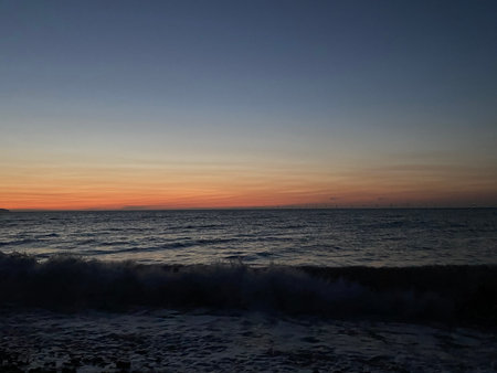 Beautiful sunset over the sea. The sun sets over the sea.の写真素材