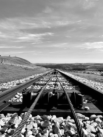 Railway track on the top of the hill. Black and white photo.の写真素材