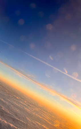 Cloudscape, Colored Clouds at Sunset near the Ocean. View from Planeの写真素材
