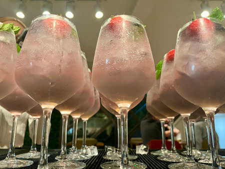 Cocktails in a row on a bar counter in a restaurantの写真素材