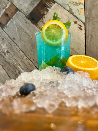 Blue lagoon cocktail with lime, blueberry, mint and iceの写真素材