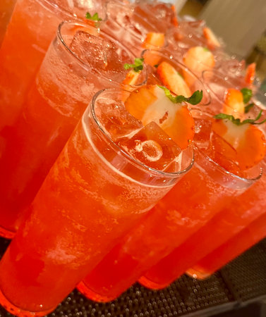Strawberry cocktail in glasses on bar counter, close-upの写真素材
