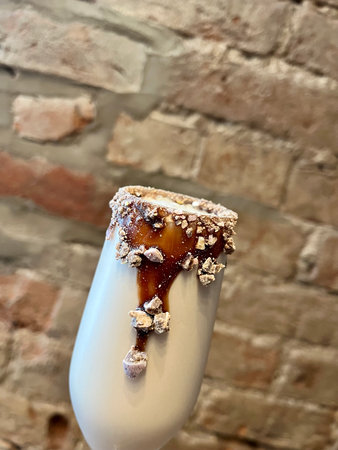 ice cream with caramel on the background of a brick wallの写真素材