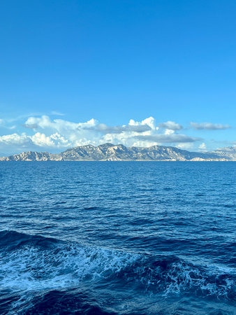 Landscape of the Mediterranean sea with mountains under the blue sky.の写真素材