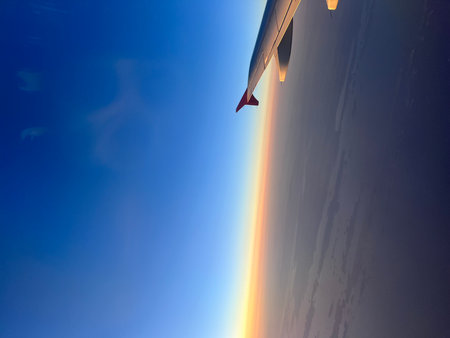 View of the wing of an airplane with a skyの写真素材