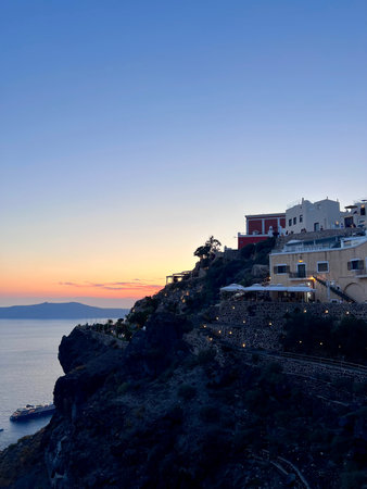 Sunset over the town of Oia, Santorini, Greeceの写真素材