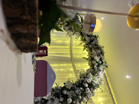 Wedding decoration with flowers and ribbons in a restaurant.の写真素材