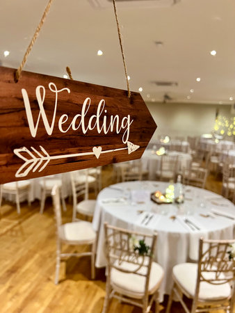Wedding Sign on a Wooden Table in a Restaurant, Vintage Styleの写真素材