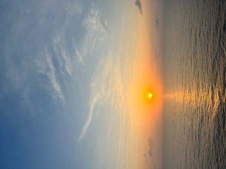 Sunset on the sea with blue sky and clouds. Beautiful background.の写真素材