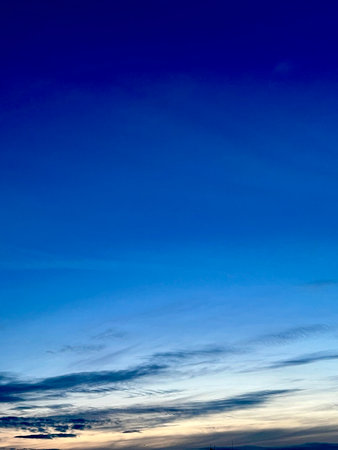 blue sky background with tiny clouds, soft focus, and copy space