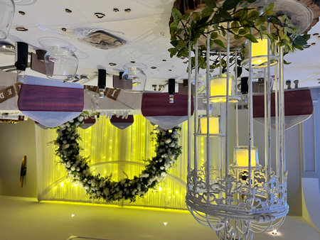 Wedding decor in the interior of a restaurant decorated with flowersの写真素材