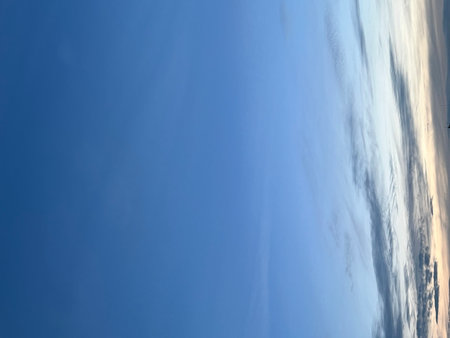 blue sky background with tiny clouds. blue sky background with tiny cloudsの写真素材