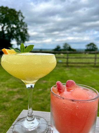 Cocktails in a glass on a table in the garden.の写真素材