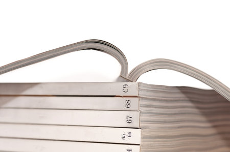 A stack of books with the numbers 1 through 9 on the spine. The books are lined up in a row