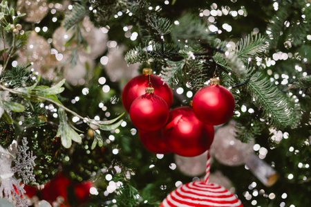 A tree with red and white ornaments on it. The red ornaments are in the shape. Christmasの写真素材