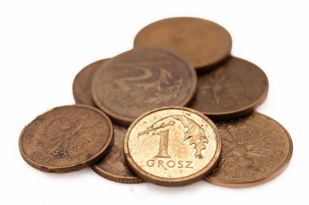 A pile of coins with a gold coin in the middle. The gold coin has the number 1 on it