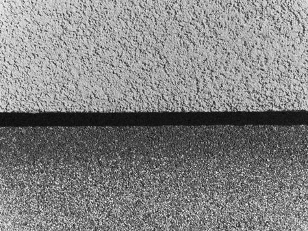 A wall with a black line on it. The wall is gray
