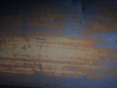 A rusty metal surface with a blue and brown color. The surface has a lot of scratches and marks