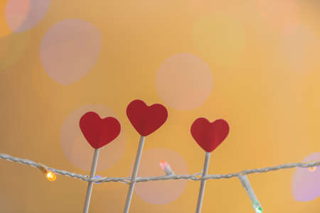 valentines day ornament de light and three red heartsの写真素材