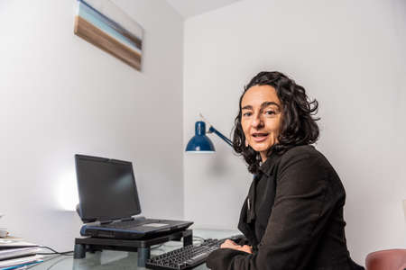 portrait caucasian woman on white background working from home