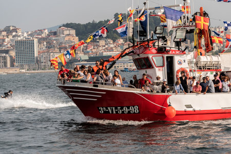 vigo bay, pontevedra , spain, july 16, 2022: ships on traditional procession maritime seafarersのeditorial素材