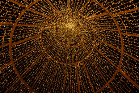 beautiful background lighting, view of christmas tree lights from below, small bokeh under the dark...