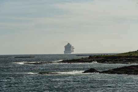 Vigo, Spain. Apr, 19th, 2023. the luxury cruise ship Britannia from southampton sails into the south channel of the Vigo bay to set course for lisbon with its 330 meters in length and its almost 7000 passengers and crew on board. The ship has been accompaのeditorial素材