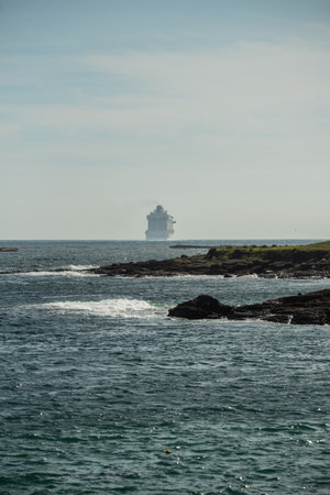 Vigo, Spain. Apr, 19th, 2023. the luxury cruise ship Britannia from southampton sails into the south channel of the Vigo bay to set course for lisbon with its 330 meters in length and its almost 7000 passengers and crew on board. The ship has been accompaのeditorial素材