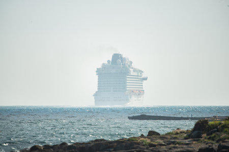 Vigo, Spain. Apr, 19th, 2023. the luxury cruise ship Britannia from southampton sails into the south channel of the Vigo bay to set course for lisbon with its 330 meters in length and its almost 7000 passengers and crew on board. The ship has been accompaのeditorial素材
