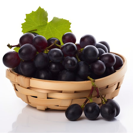 Basket of fresh ripe black grapes isolated on a white background.の素材