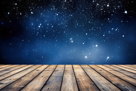 Wooden floor against starry night sky background with space for textの素材