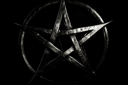 Tattoo art in the form of a star on a black backgroundの素材