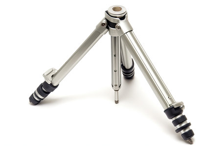 a small metal tripod with black rubber tipsの素材
