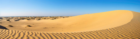 a sand dune with blue skyの素材