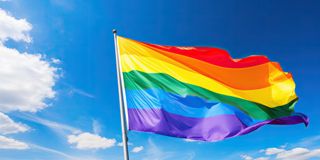 a rainbow flag on a poleの素材