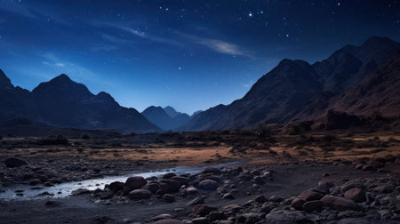 a rocky landscape with mountains and starsの素材