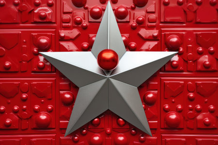 a silver star with a red ball on topの素材