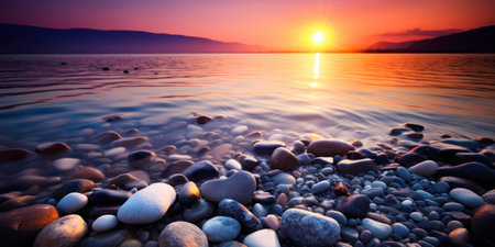 a sunset over a body of waterの素材