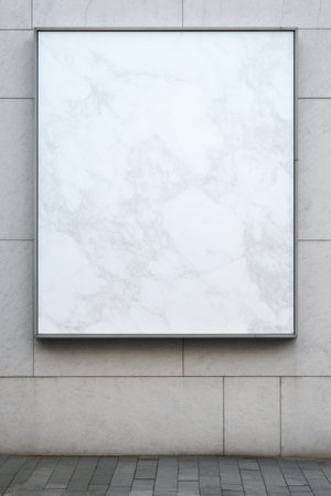 a white square sign on a stone wallの素材