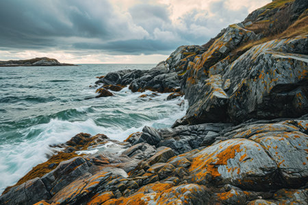 a rocky shore with waves crashing on rocksの素材