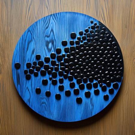 a blue and black round object on a wood surfaceの素材