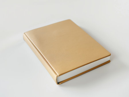 golden leather-bound book on white backgroundの素材