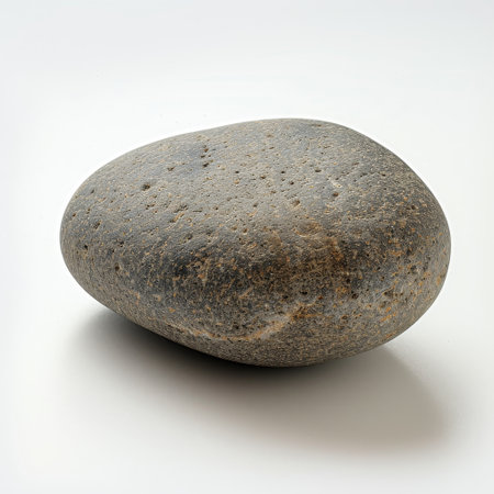 Smooth river stone on white backgroundの素材