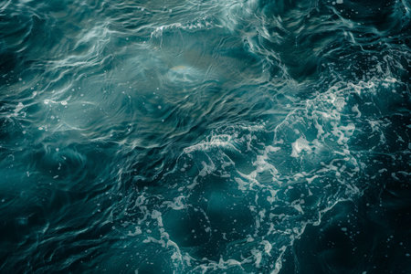 Swirling waves of teal and turquoise waterの素材