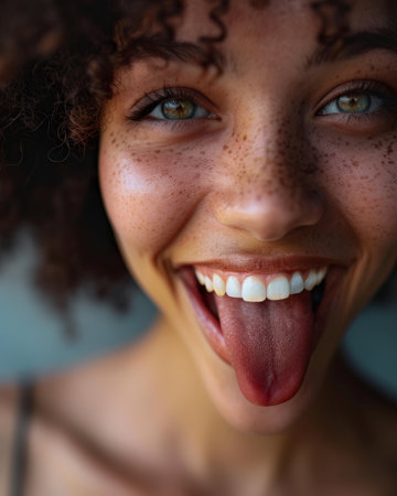 close-up of a smiling person's faceの素材