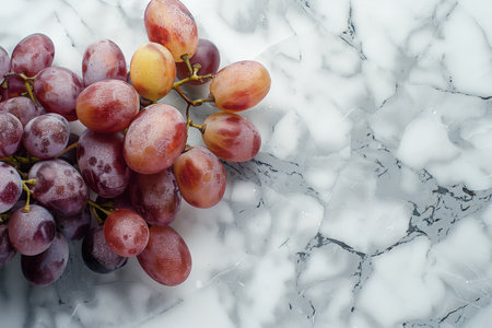 Juicy red grapes on a marble backgroundの素材